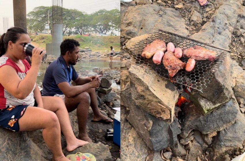  Jaru: Casal faz churrasco no fundo seco do Rio Jaru, em meio a estiagem histórica