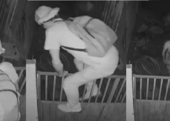 Suspeitos são informados câmera ao escalar grade dos fundos de comércio em São Francisco do Guaporé